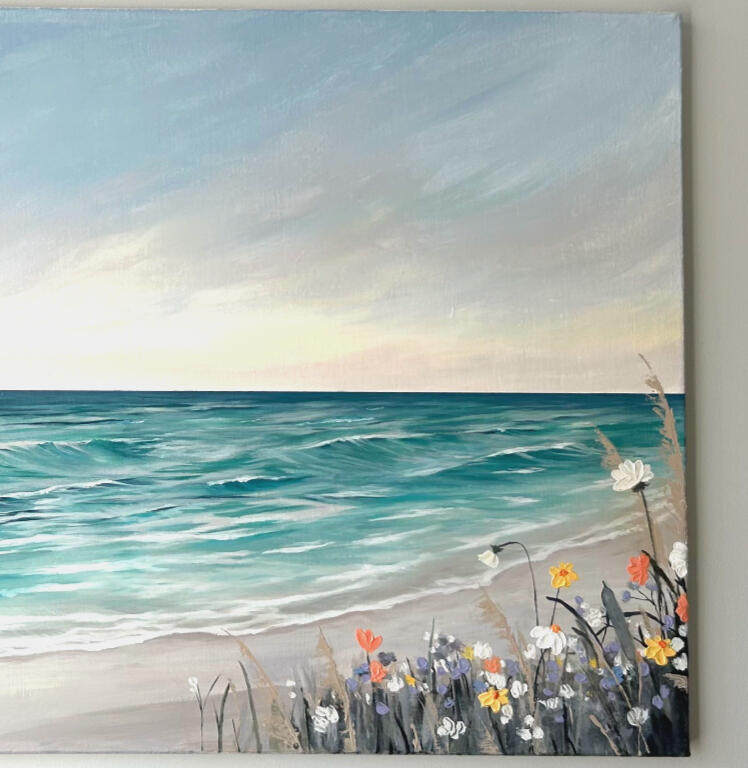 close up of a larger seascape painting featuring a wide sea view with waves seen from a distance and textured flower bushes